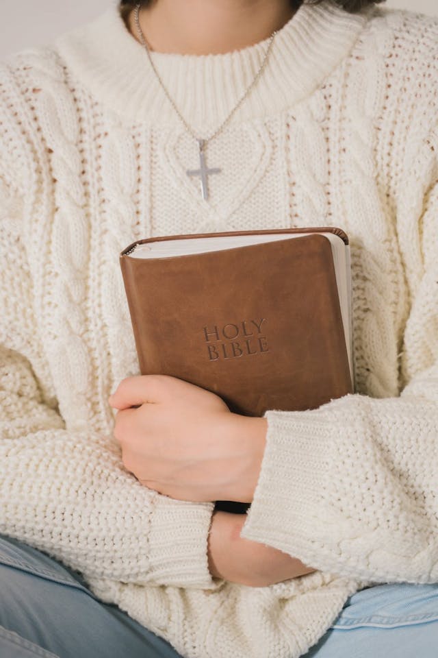 Image for a girl holding a Bible.